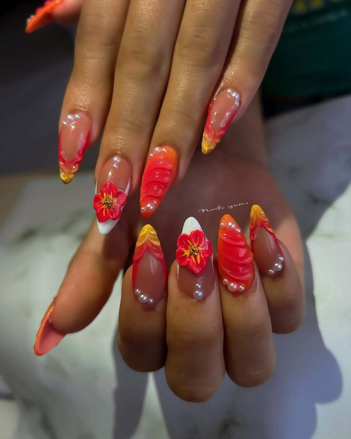 16. Fiery Red and Orange Hibiscus Bloom