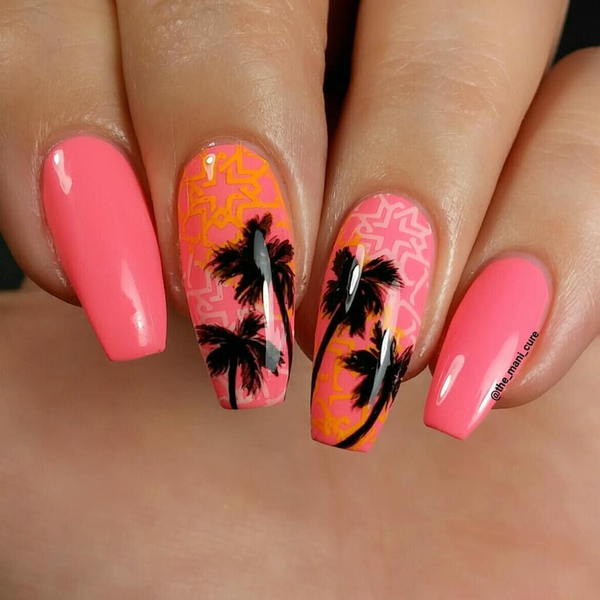17. Sunset-Inspired Coral Nails with Palm Tree Silhouettes