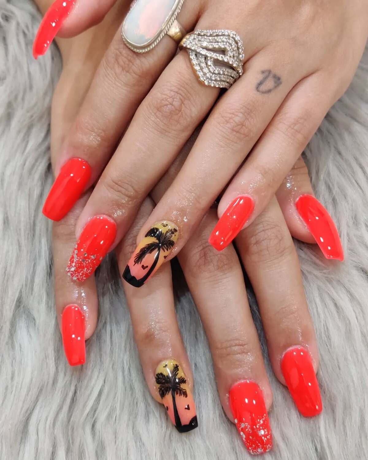 25. Fiery Sunset Nails with Palm Tree Accents