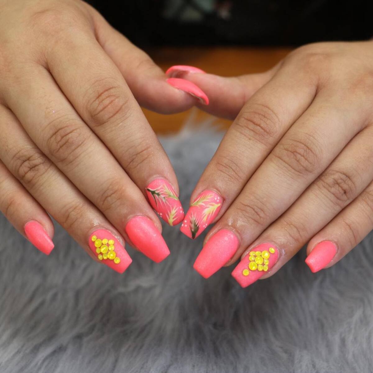 6. Coral Glow with Golden Embellishments