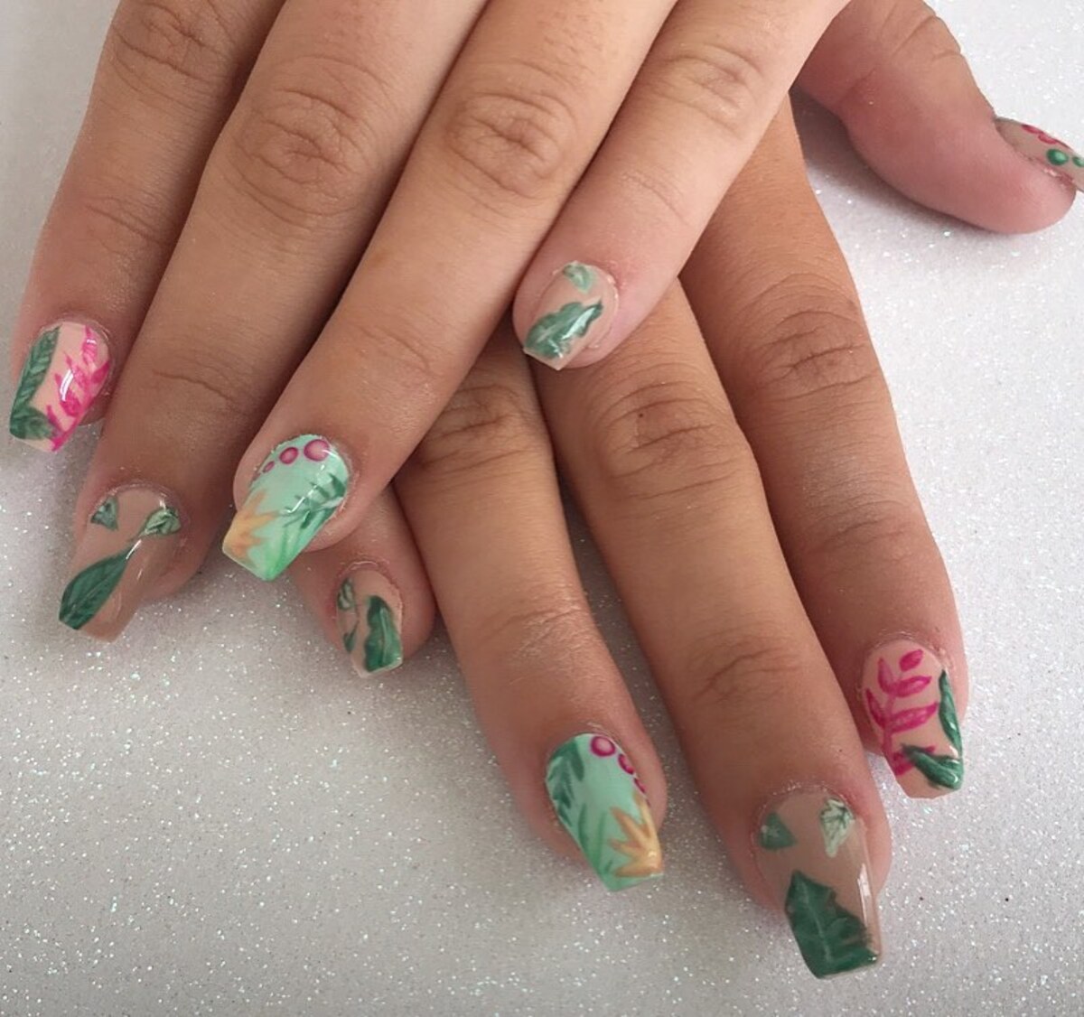 9. Delicate Jungle-Inspired Nails with Botanical Art
