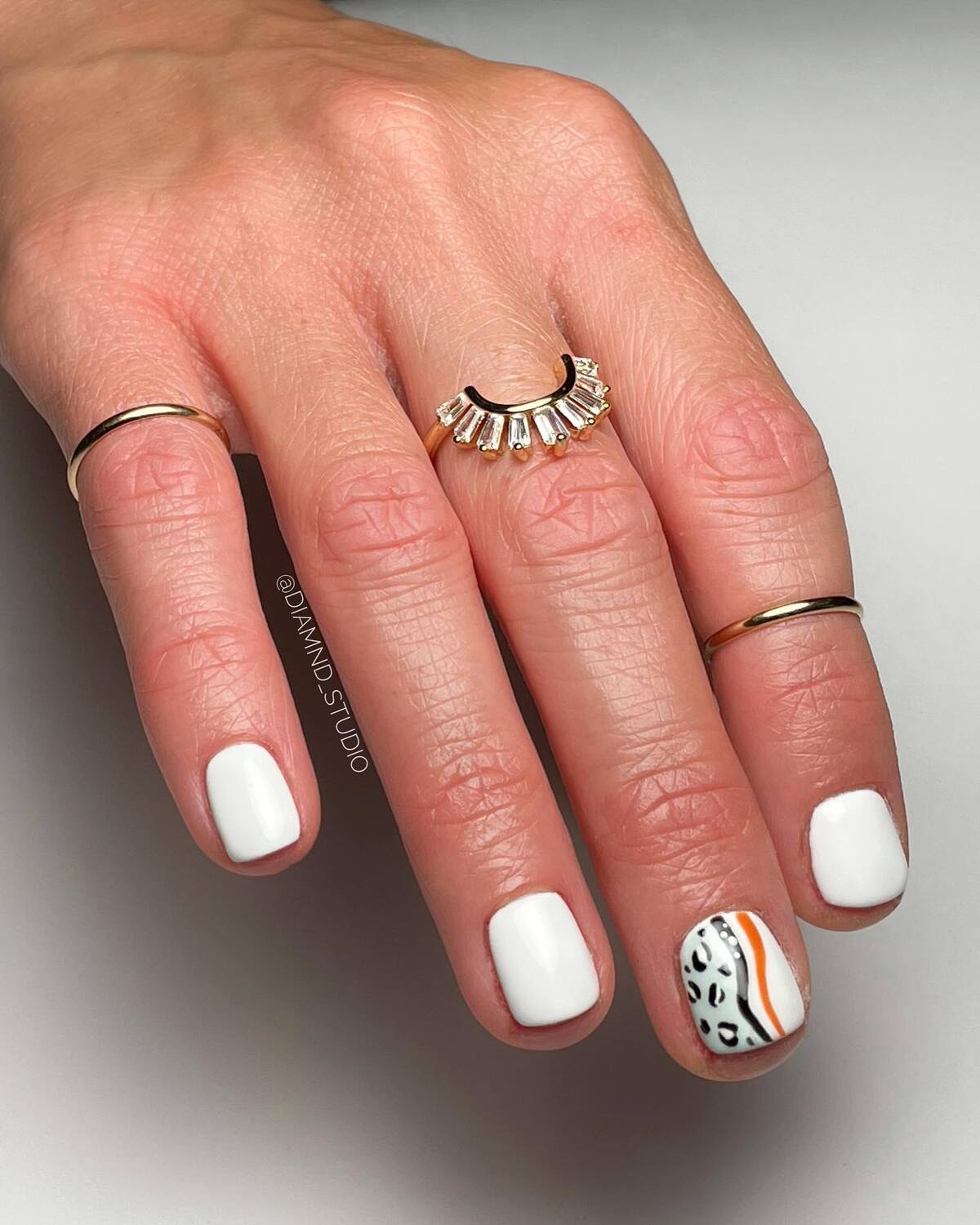21. Minimalist White with Animal Print Accent