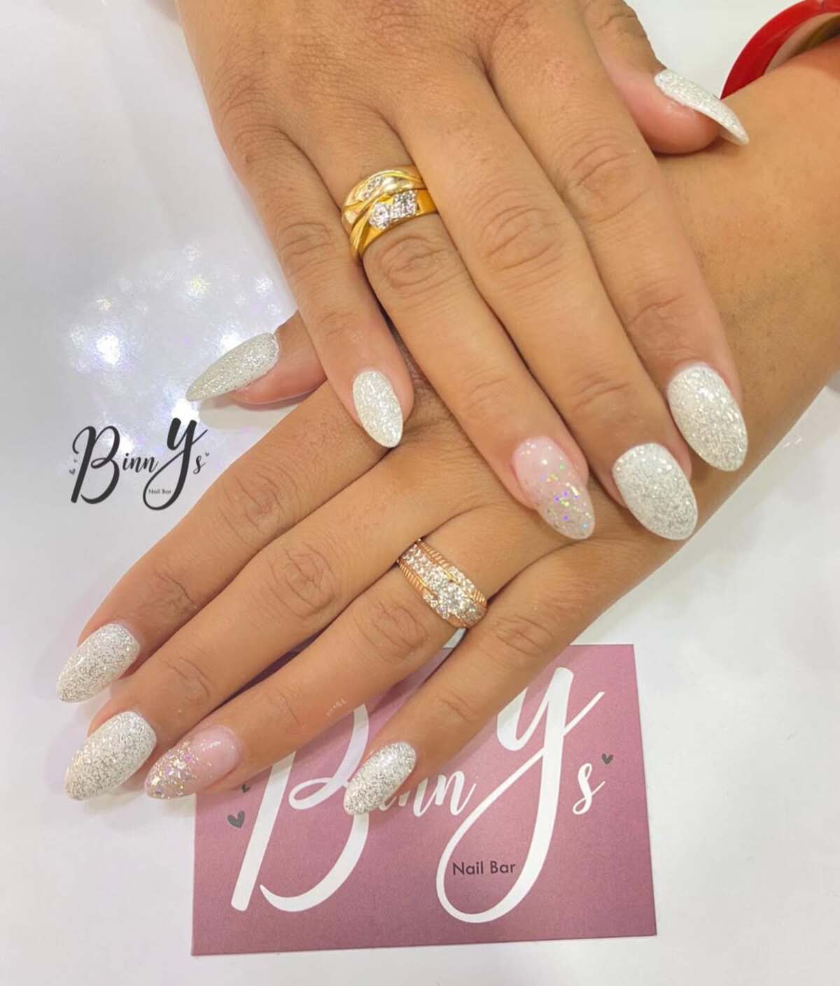 3. Glittering White Almond Nails