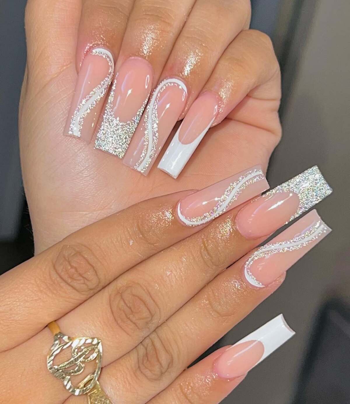 4. Sleek French Tips with Silver Glitter Swirls