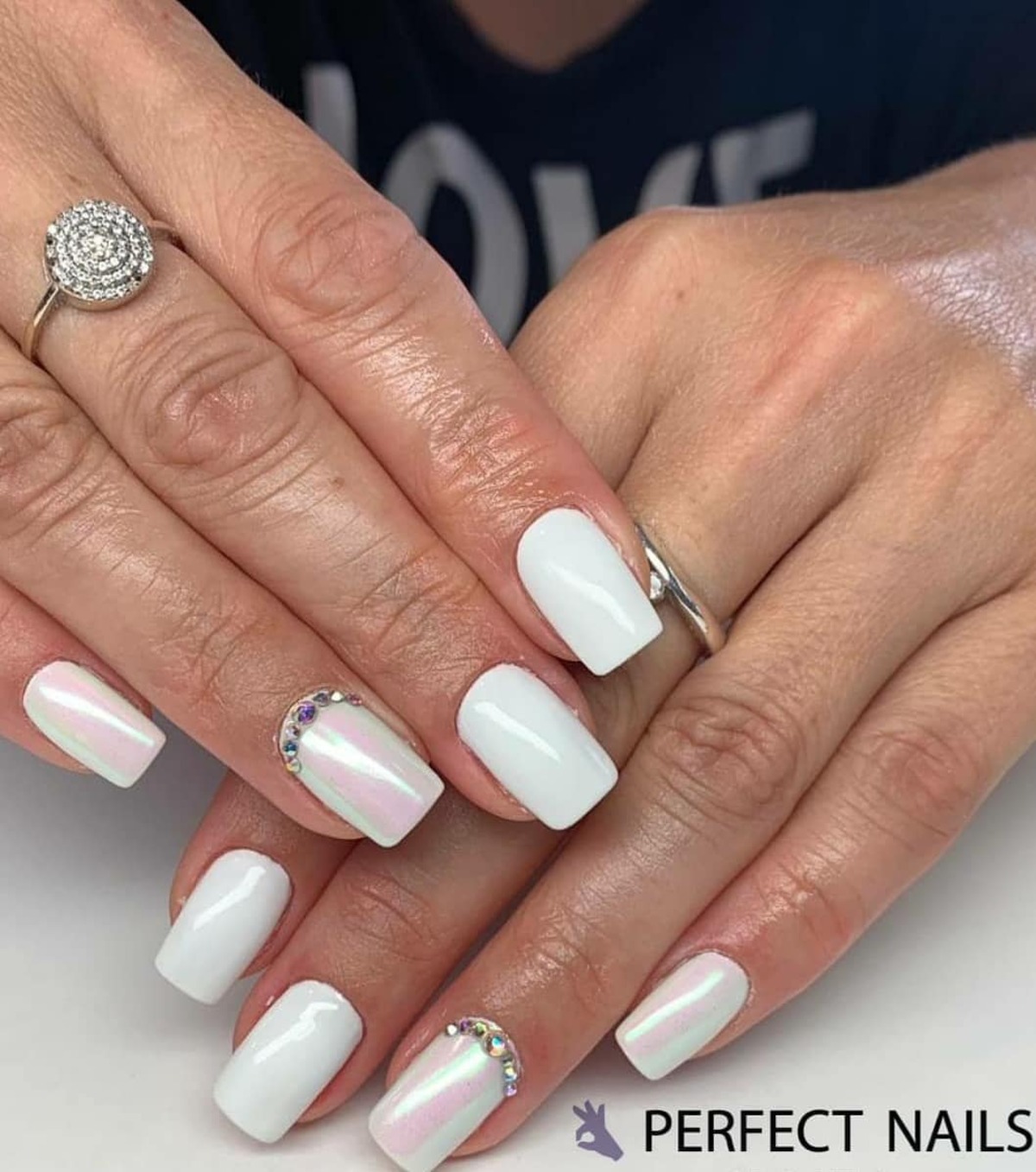 8. Classic White Nails with Crystal Accents