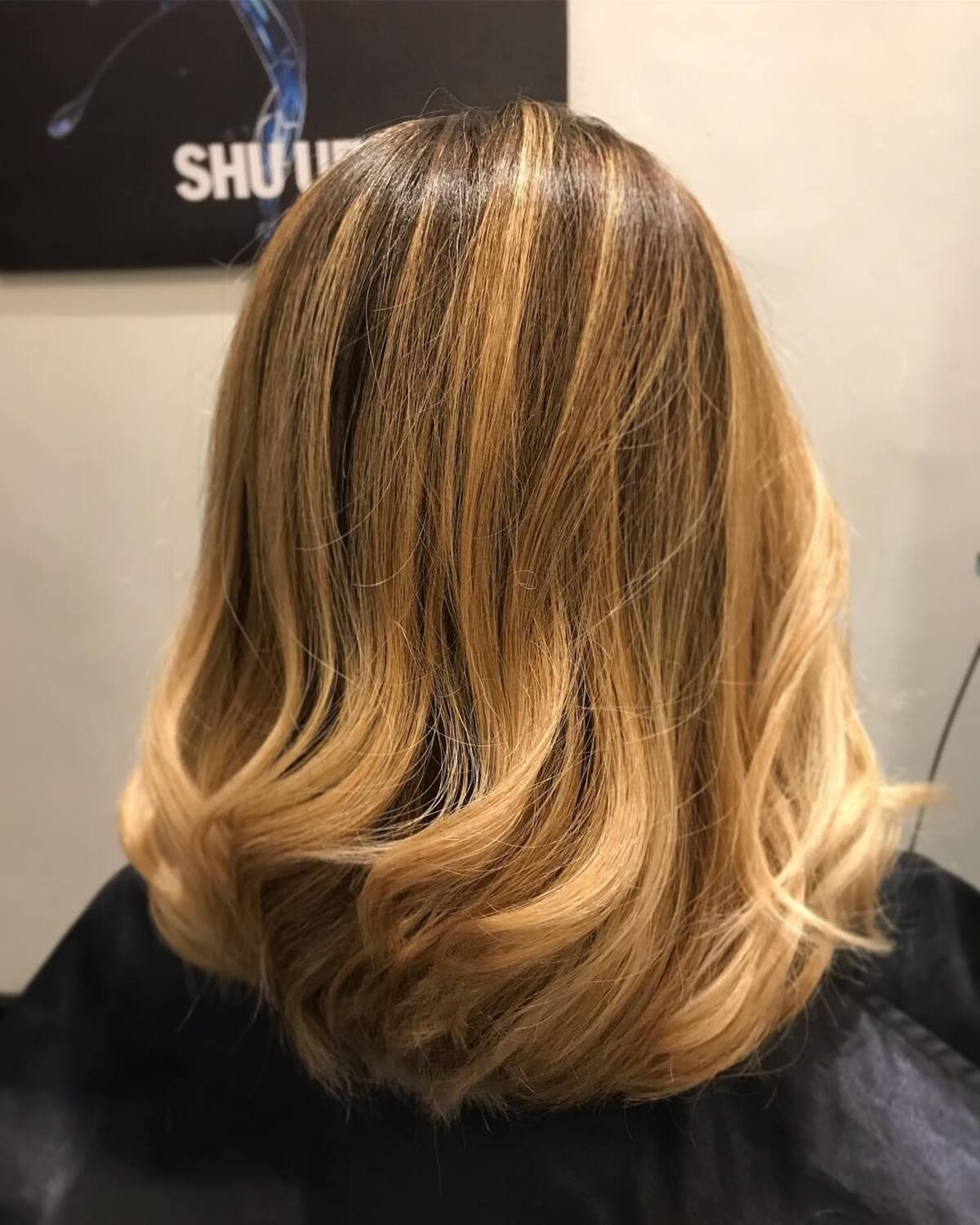 22. Golden Bronde Ombre with Soft Flicked Layers