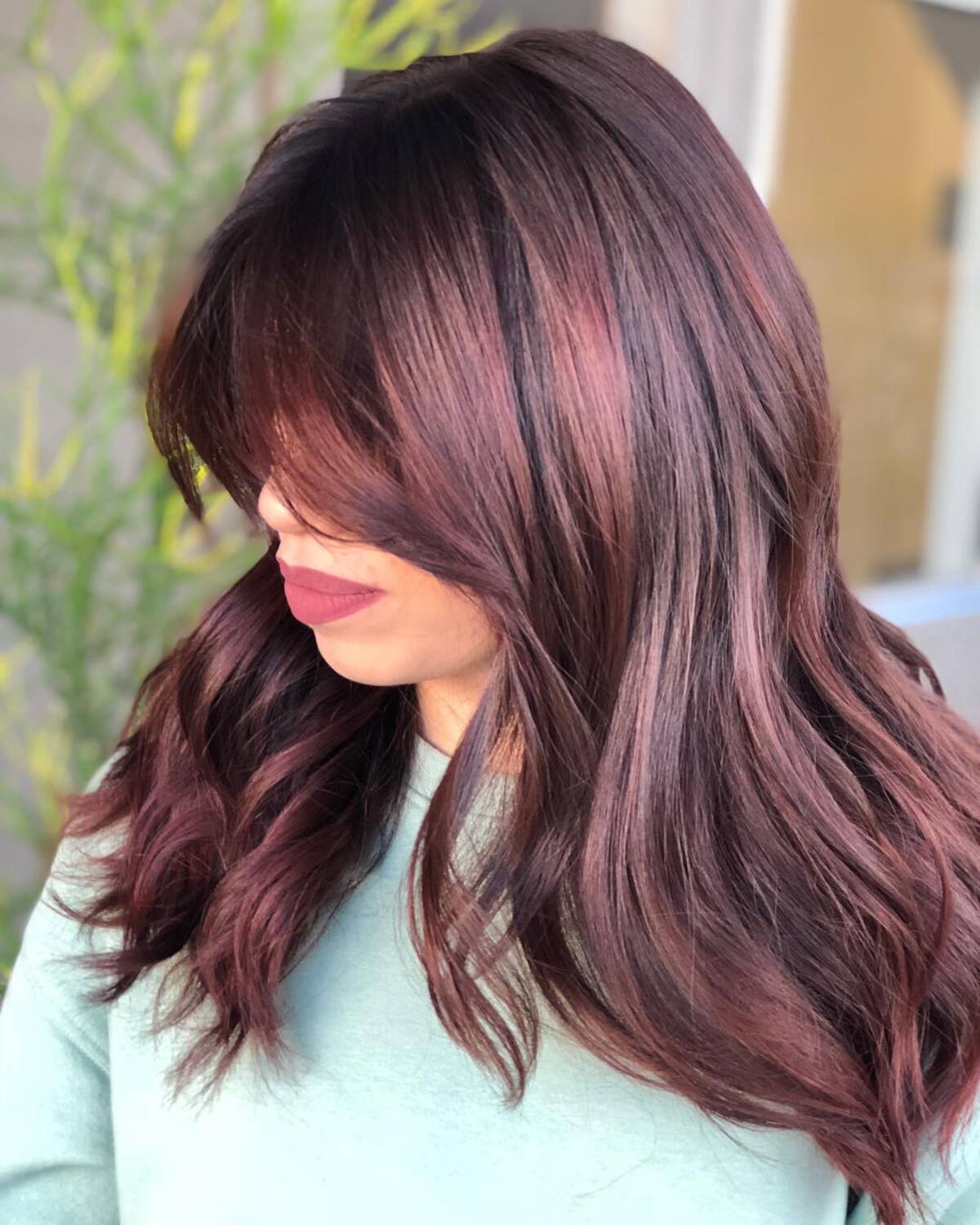 3. Deep Plum Ombre with Glossy Curls