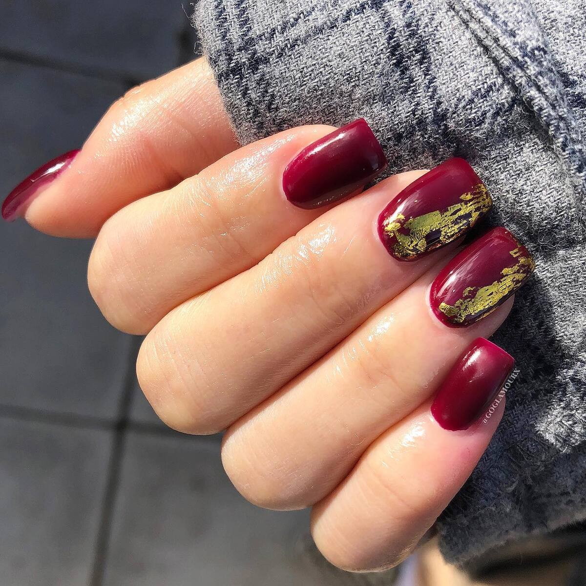 22. Rich Burgundy Glam with a Golden Accent