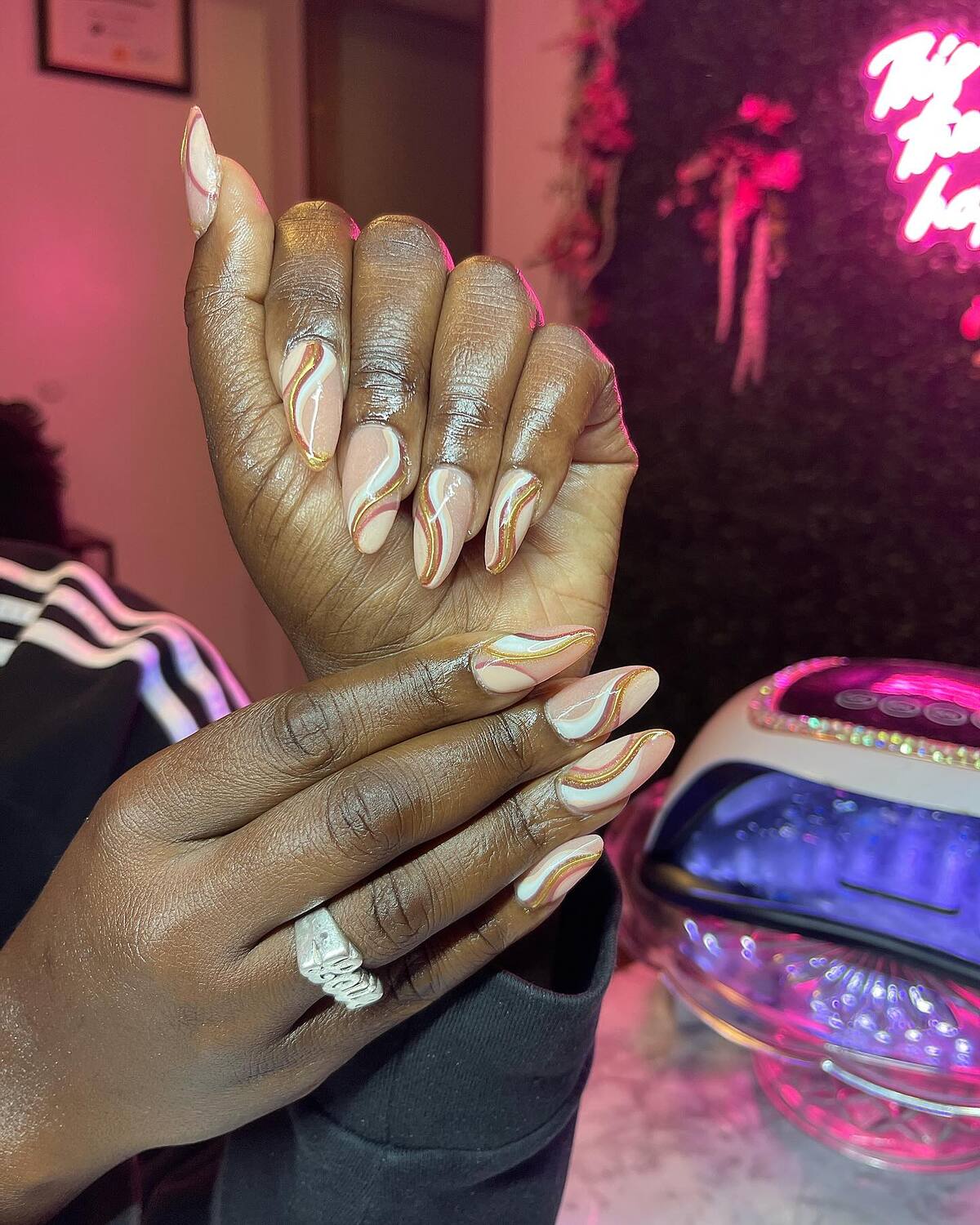 35. Golden Swirl Elegance on Almond Tips