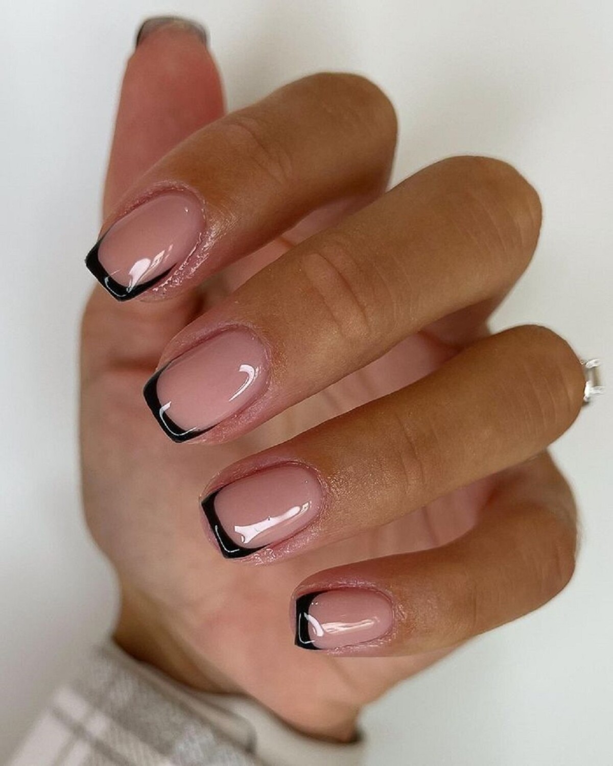 14. Modern Black French Tips with a Nude Base