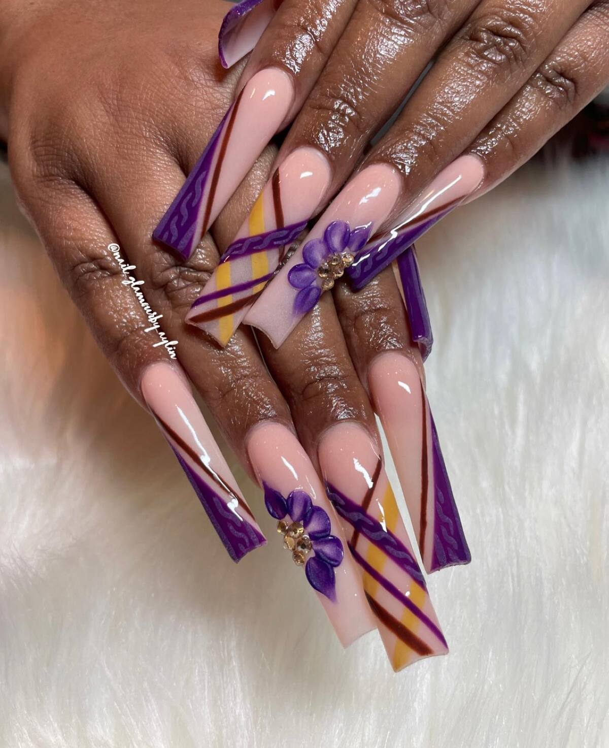 19. Plum and Gold Elegance with Floral Art
