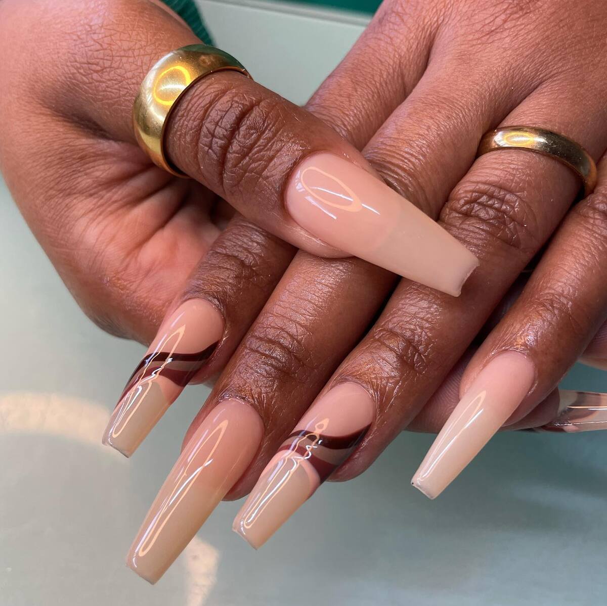 25. Caramel Swirl Tips with Glossy Nude Base