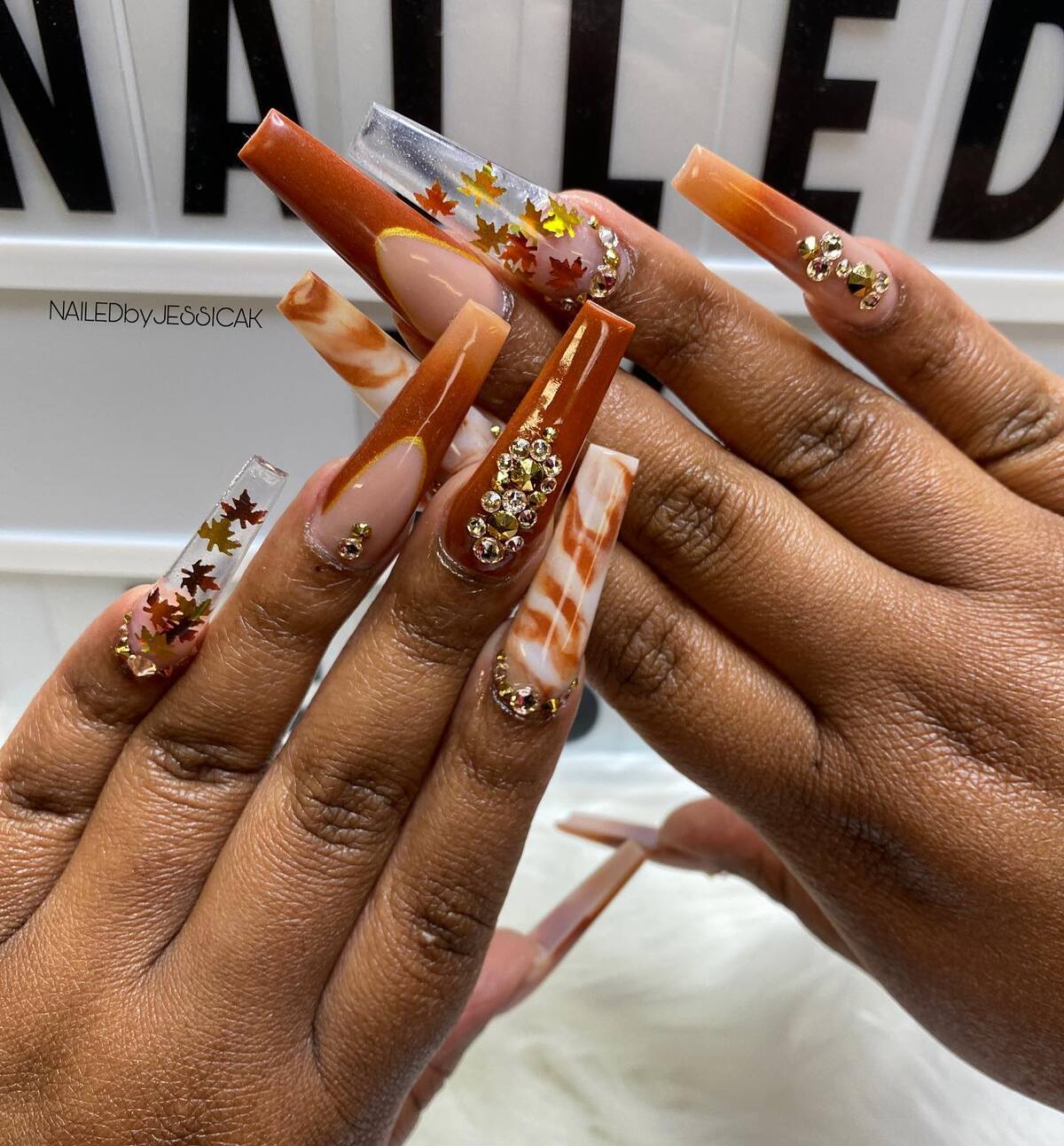 4. Fall Glam with Maple Leaves and Gold Accents