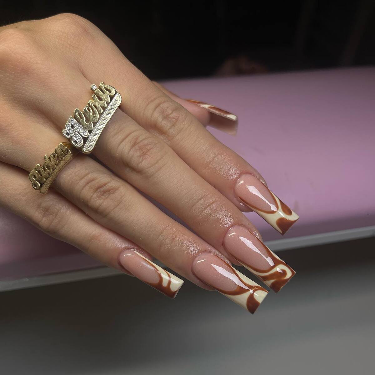 11. Mocha Swirl French Tips with a Glossy Finis
