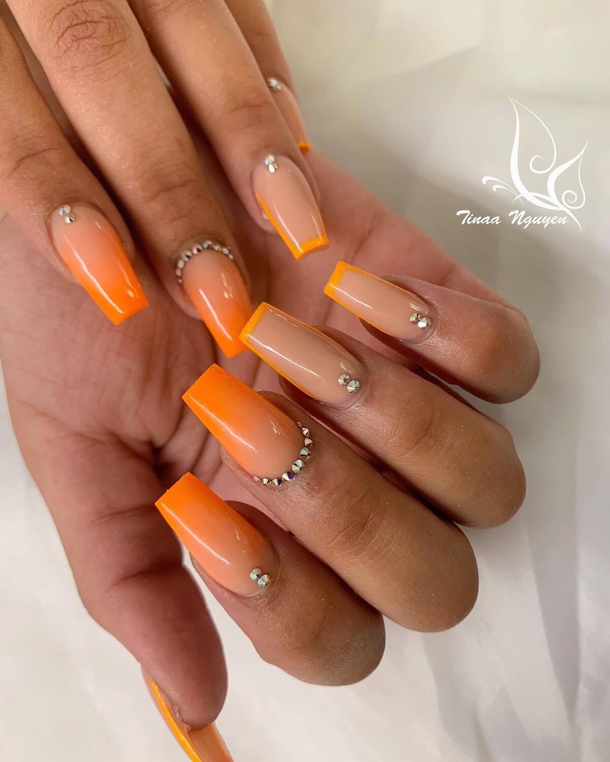 15. Neon Pumpkin Tips with Crystal Accent