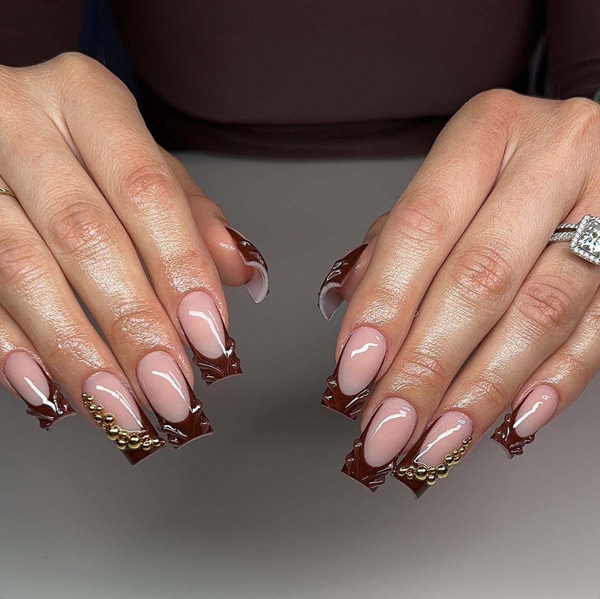 20. Glossy Chocolate Drips With Golden Accents