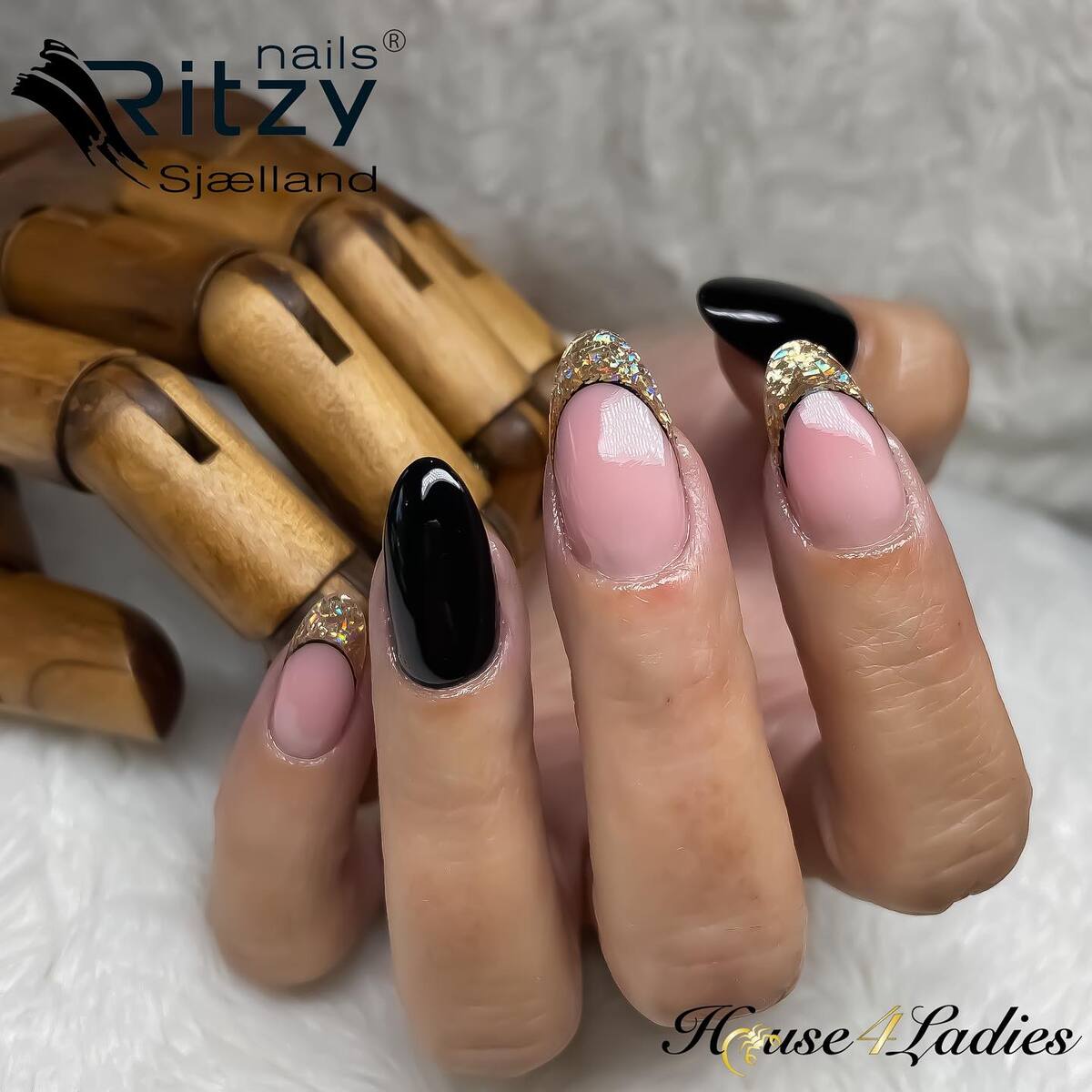 21. Midnight Glam with Gold Glitter Tips