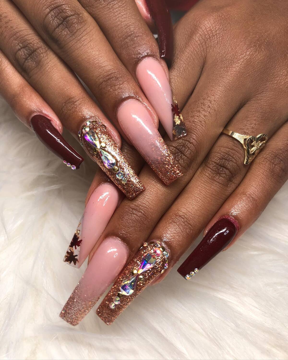 7. Burgundy & Rose Gold Glam with Crystal Accents