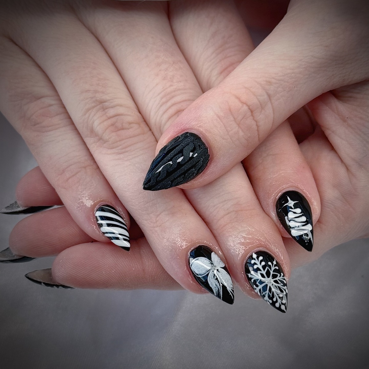 1. Chic Black and White Christmas Nails