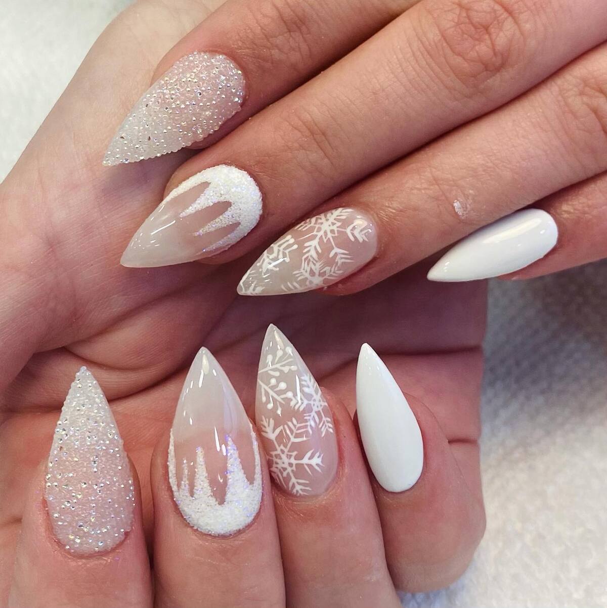 12. Magical White Christmas Snowflake Nails