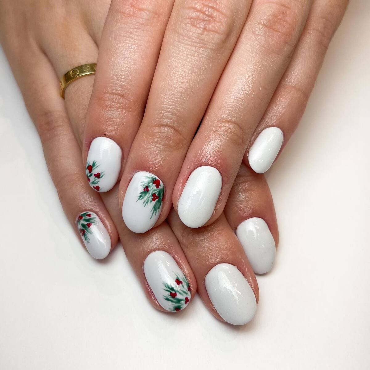 20. Classic White Christmas Nails with Holly Accents