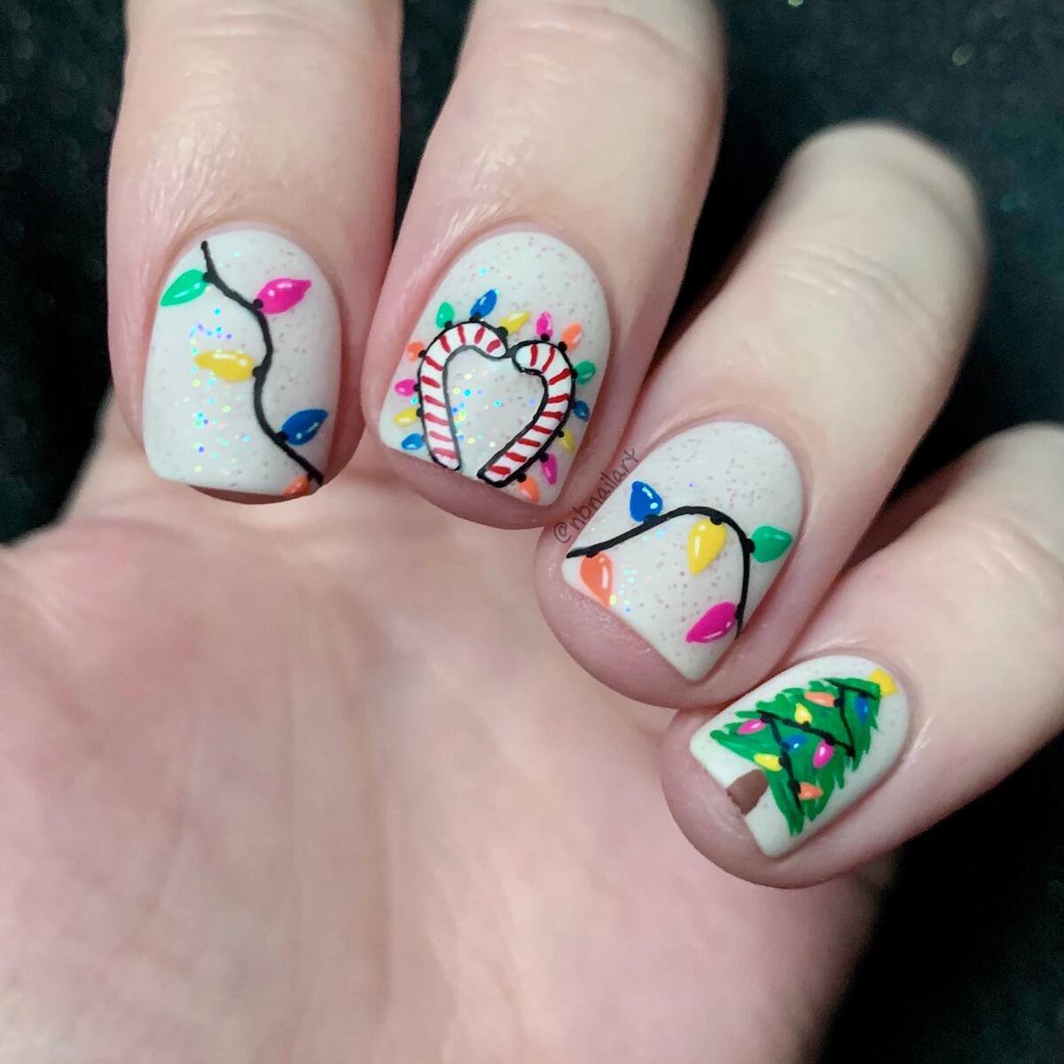 23. Bright Christmas Lights and Candy Cane Nails
