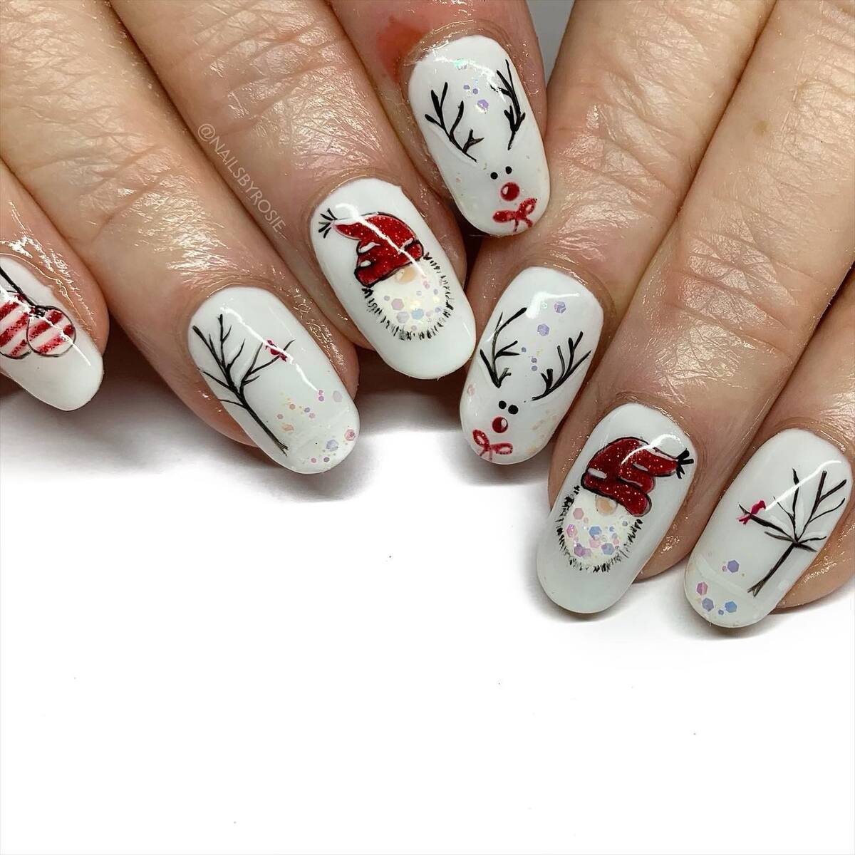 24. Festive Christmas Reindeer and Santa Hat Nails