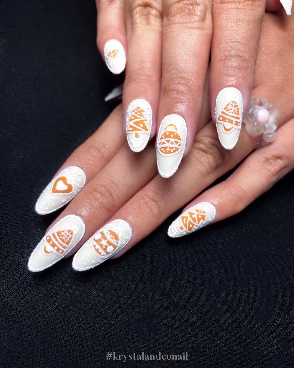25. Bold White Christmas Nails with Golden Accents