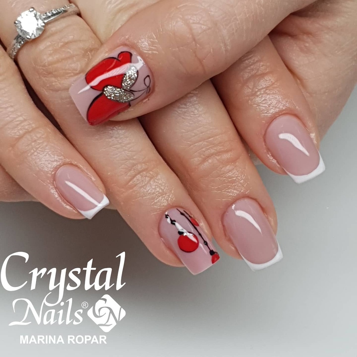 10. Chic French Tips with Festive Accents