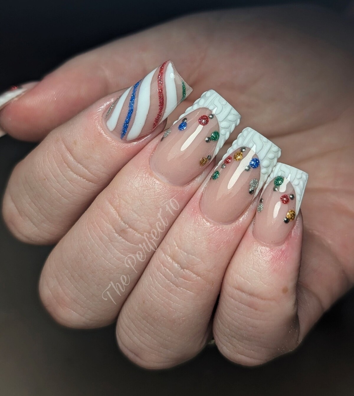 17. Christmas Lights and Candy Cane Nails