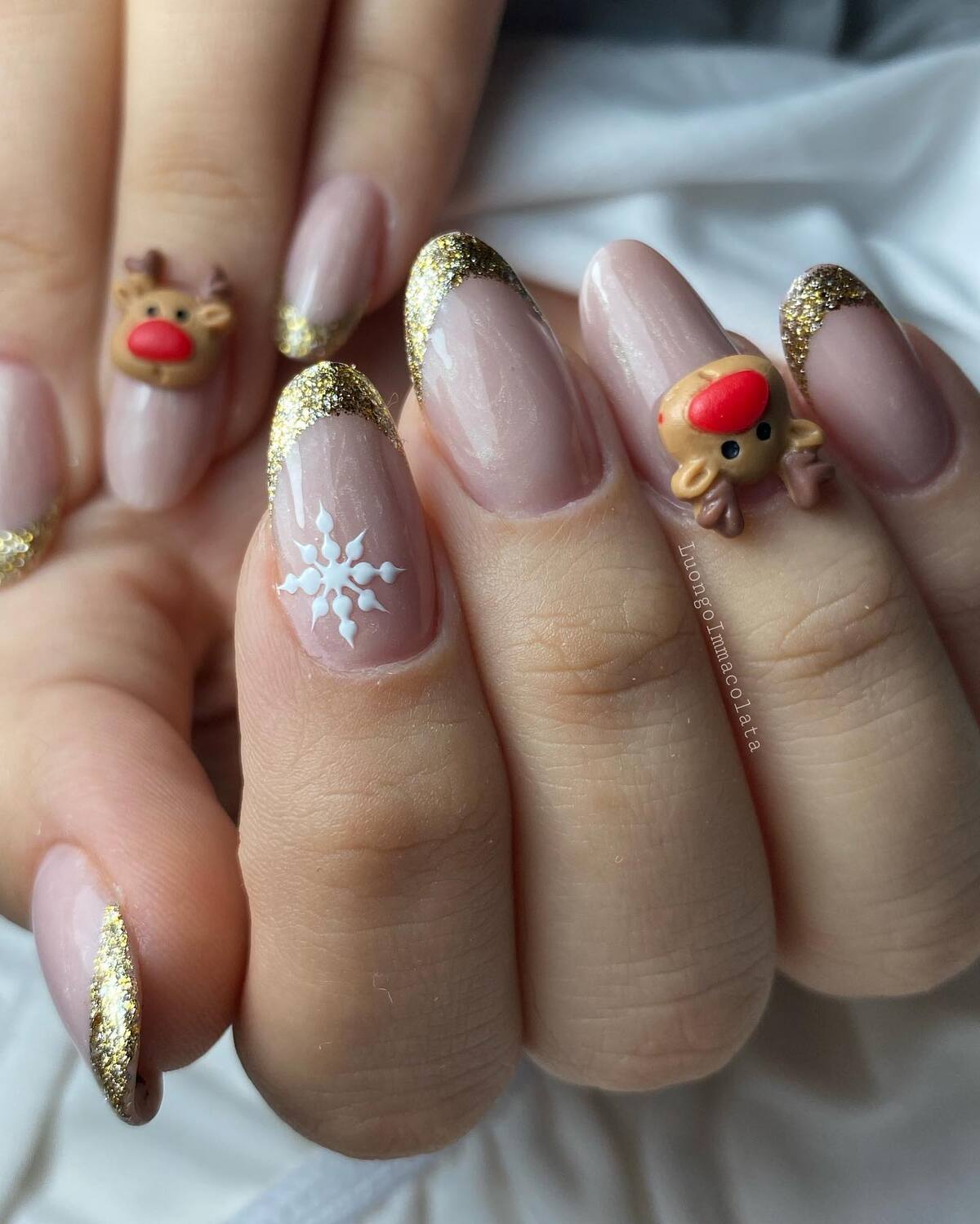 21. Golden Glitter French Nails with Reindeer