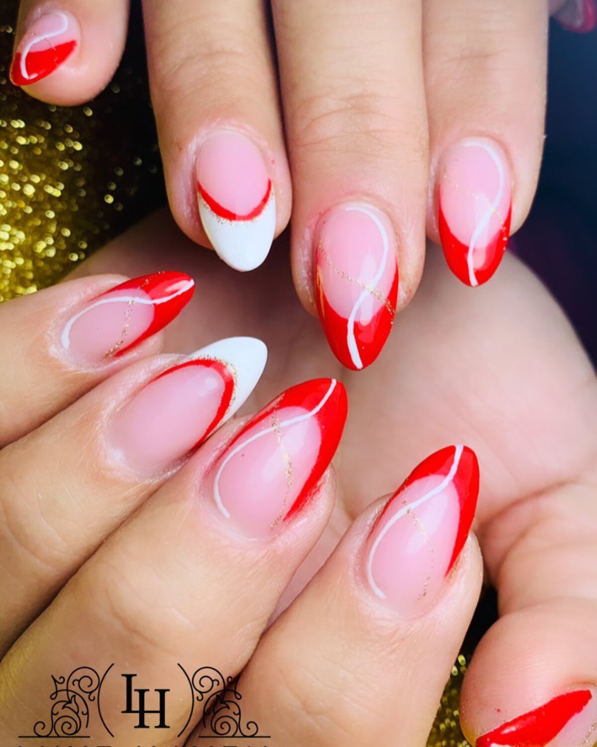 7. Swirled Red and White Christmas Nails
