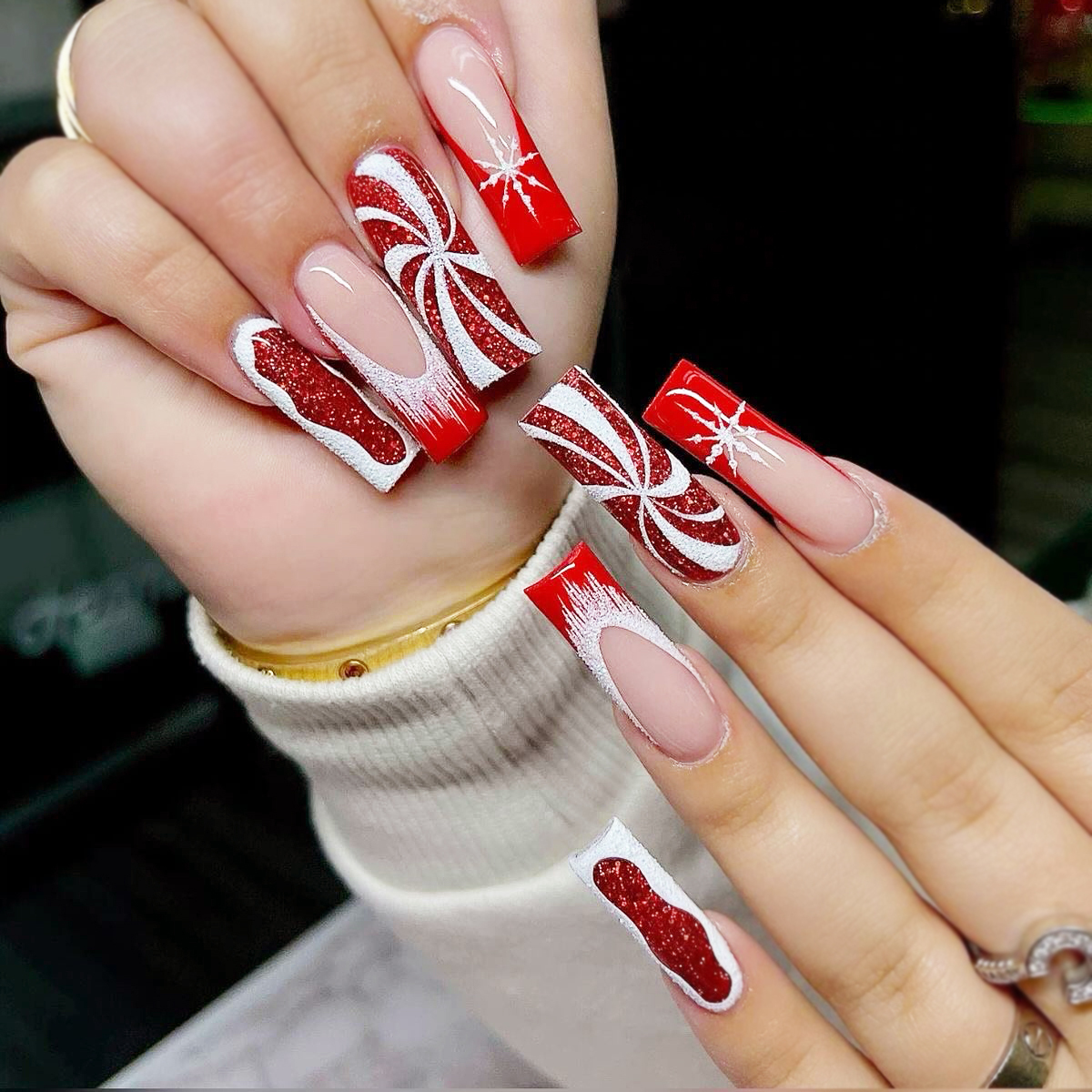 11. Sparkling Candy Cane Christmas Nails