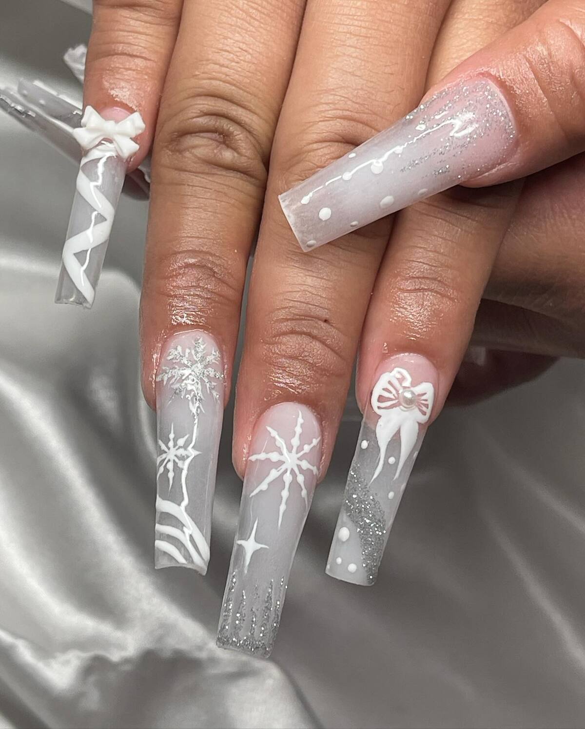 14. Snowflake & Bow Christmas Nails