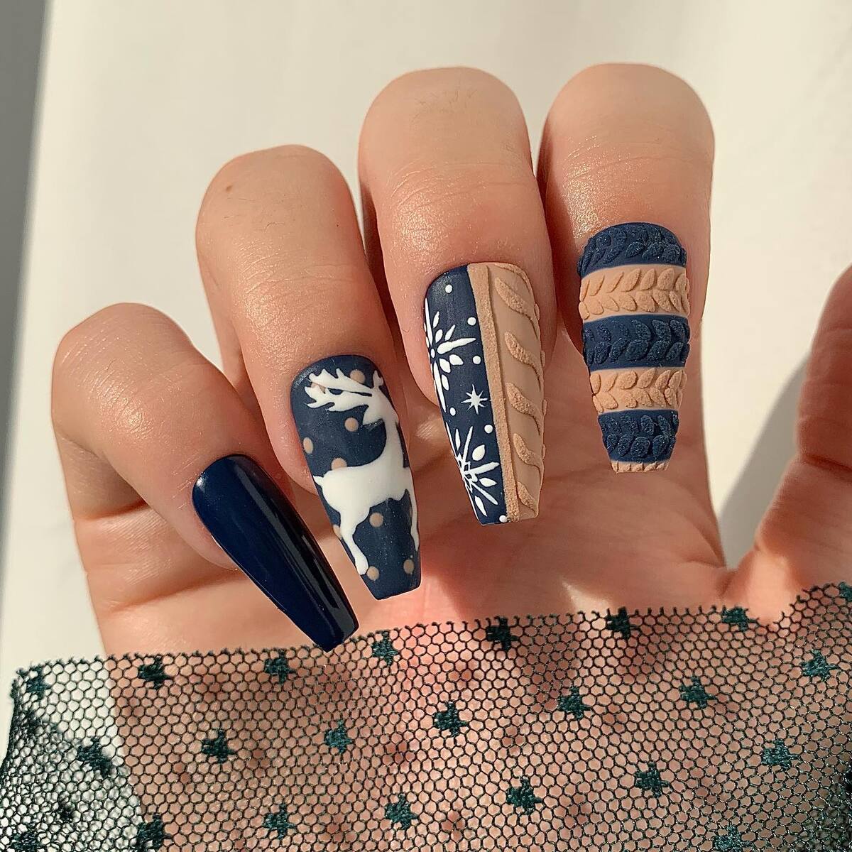 26. Cozy Sweater & Reindeer Christmas Nails