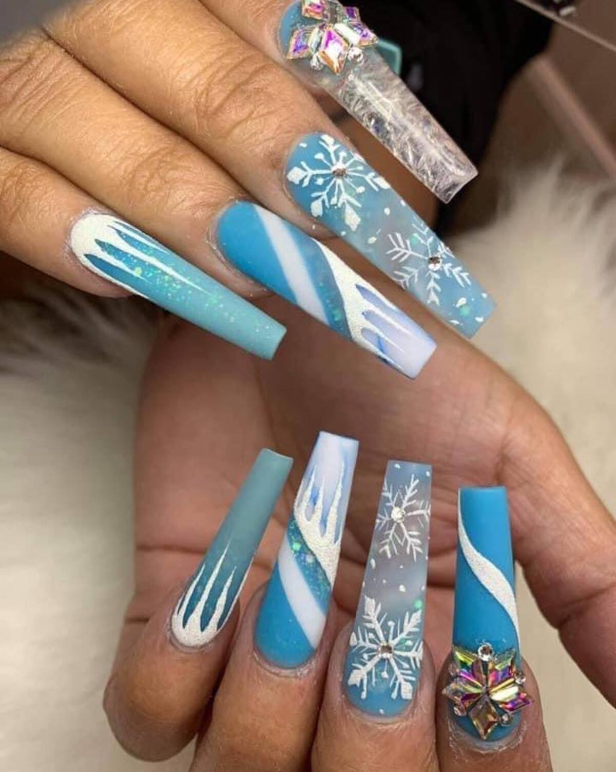 27. Frozen-Inspired Snowflake Christmas Nails