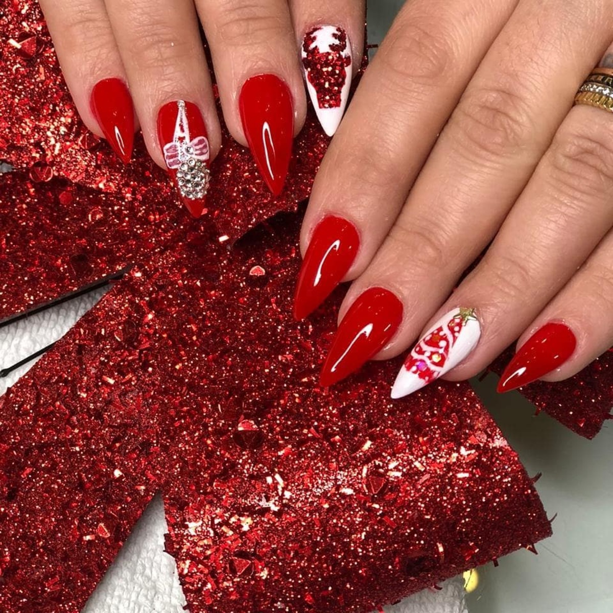 13. Bold Red Christmas Acrylic Nails with Glitter Accents