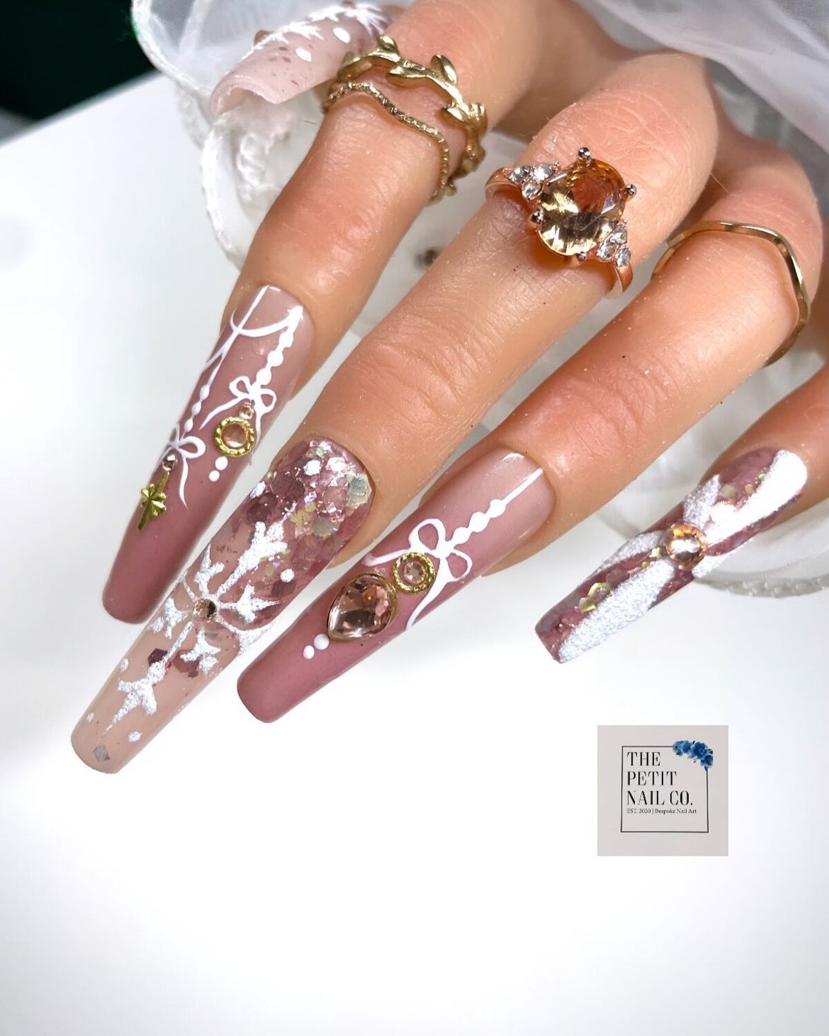 14. Elegant Nude Christmas Acrylic Nails