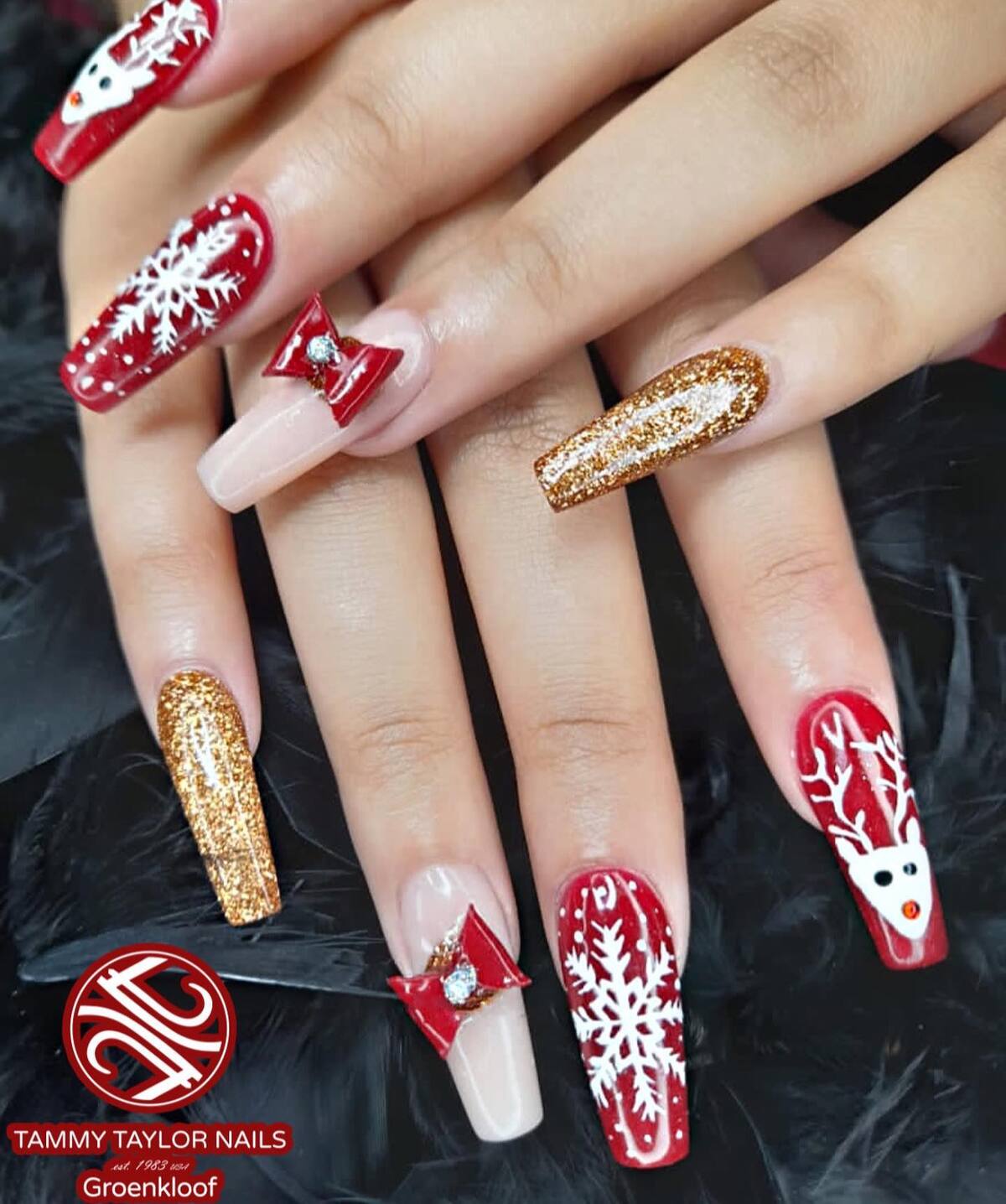 23. Festive Red and Gold Christmas Acrylic Nails