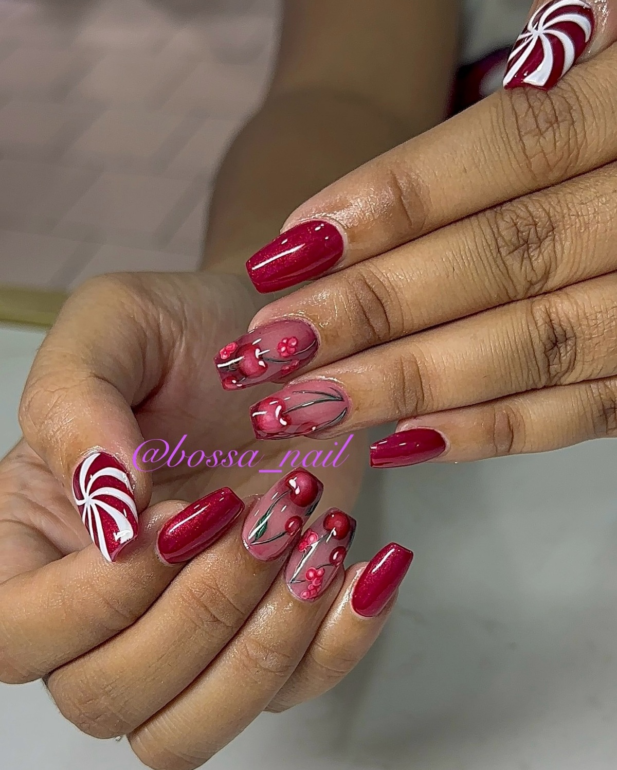 7. Red Berry Acrylic Nails with Peppermint Accents