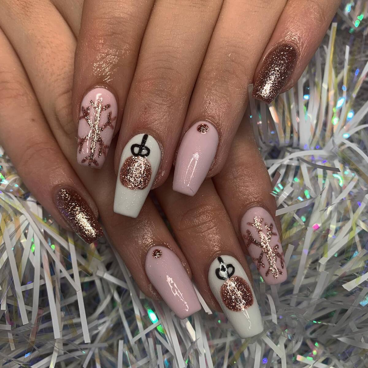 8. Rose Gold Christmas Acrylic Nails