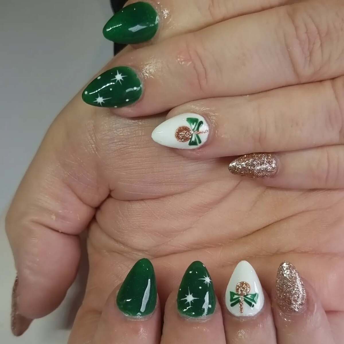 9. Green and Gold Christmas Acrylic Nails
