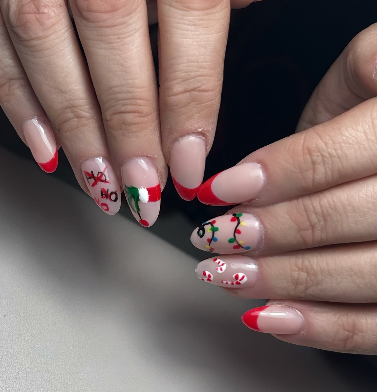 13. Playful Christmas French Oval Nails