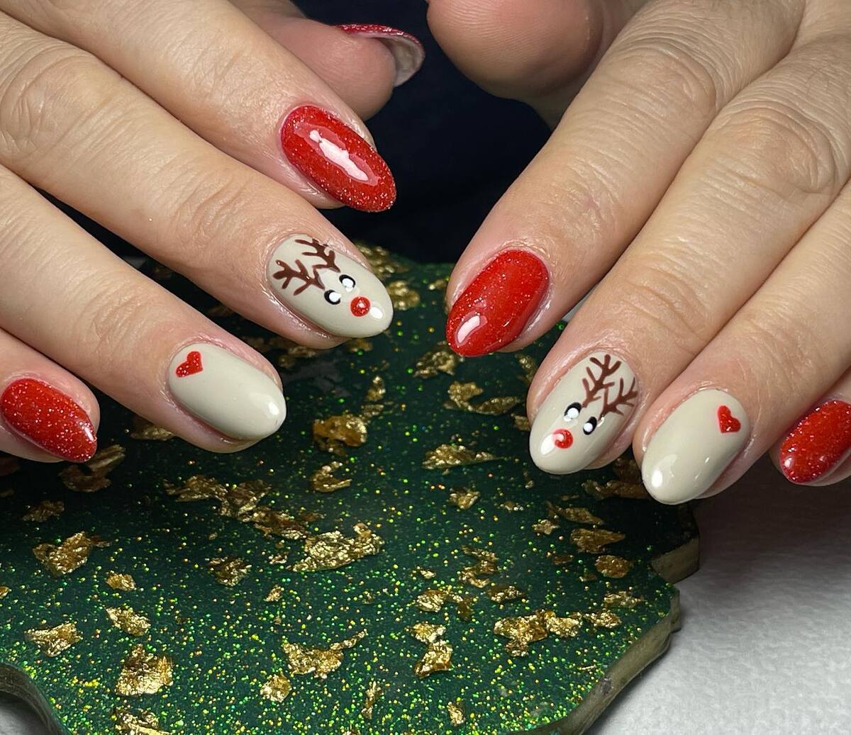 21. Rudolph Red Nose Christmas Oval Nails