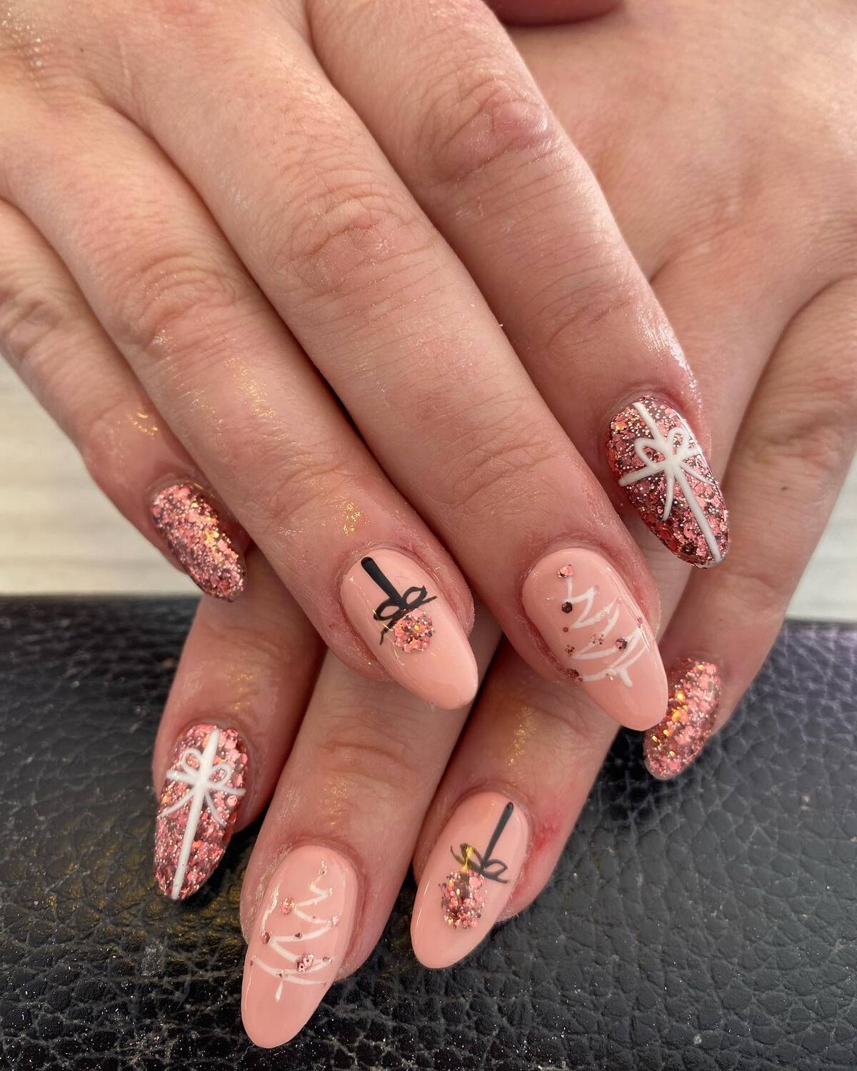 8. Glittering Christmas Gift Oval Nails