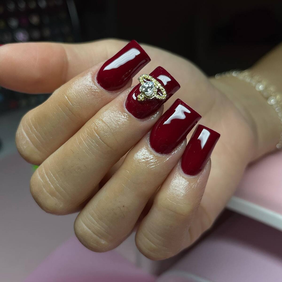 18. Classic Burgundy Luxe with Golden Gem Accent