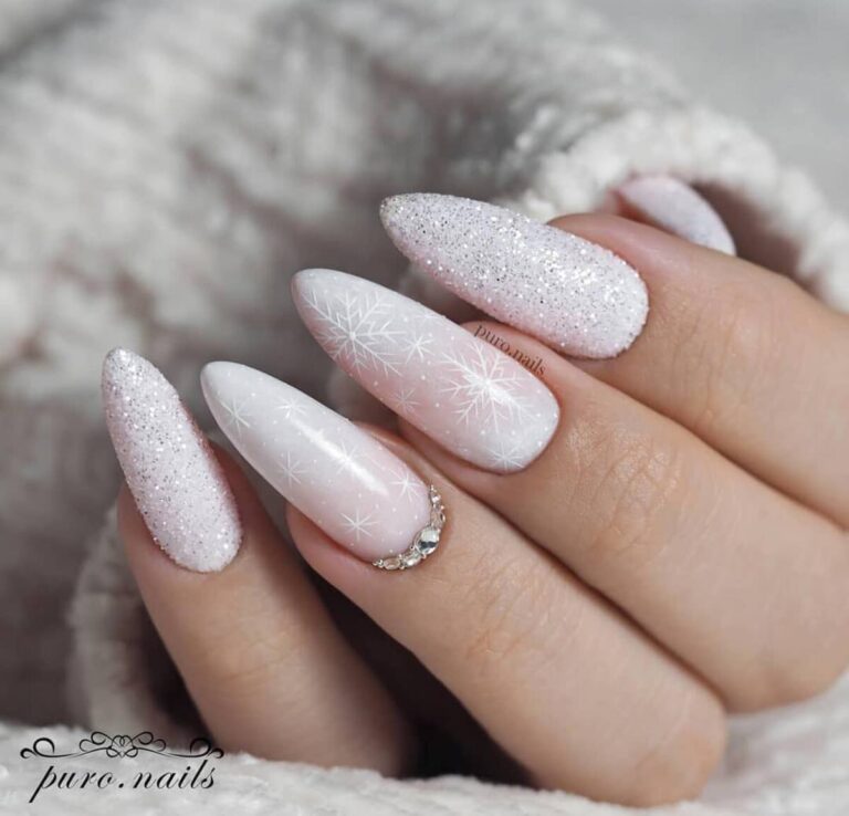 Frosty white stiletto winter nails with glitter and rhinestones