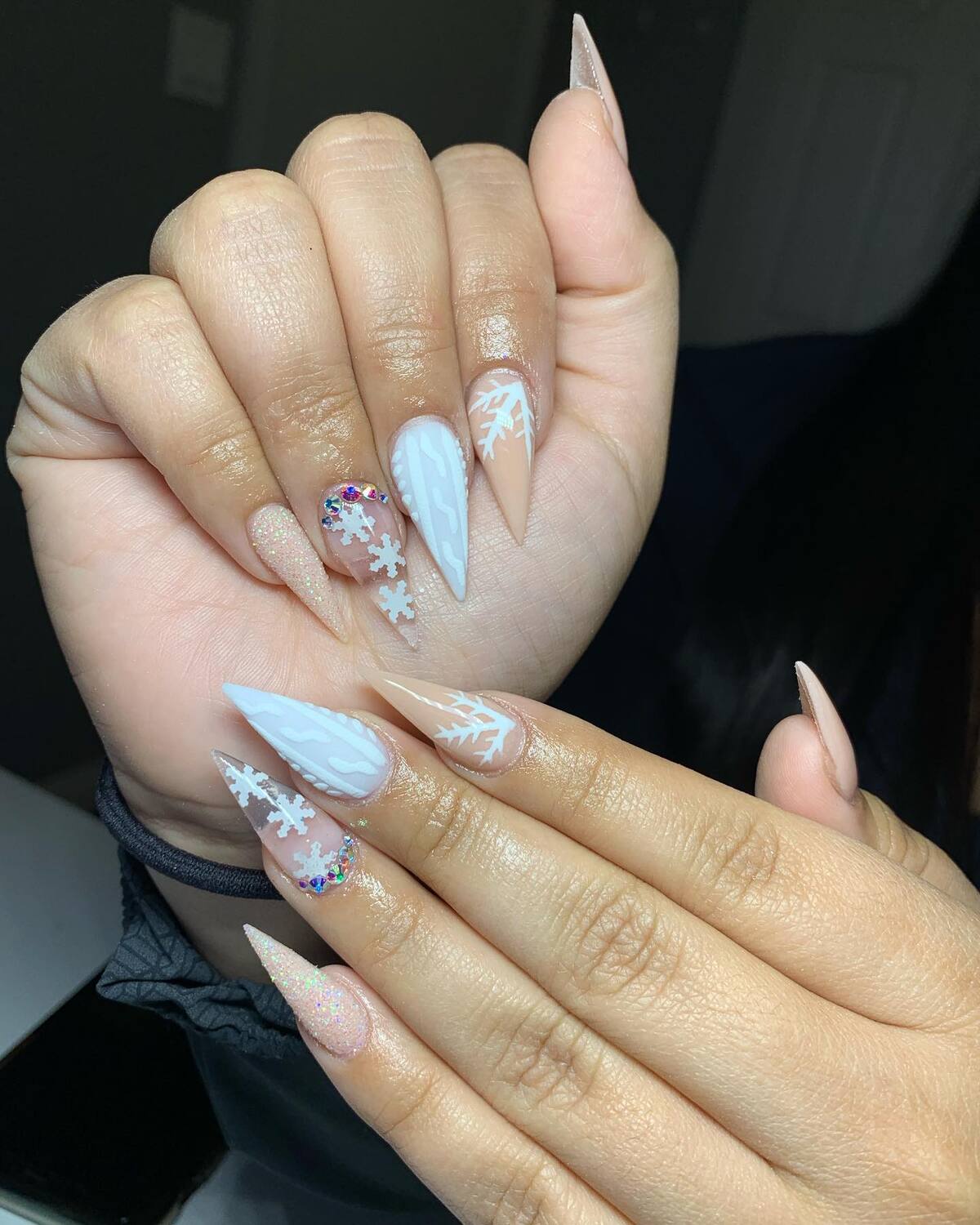 6. Frosted Nude Nails with Glitter and Snowflakes